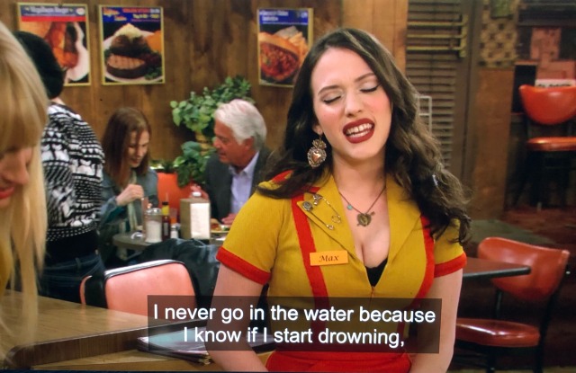 kat jennings portraying max black on the series "2 broke girls" in her waitressing uniform at the diner. she says "I never go swimming because I know if I start drowning..."