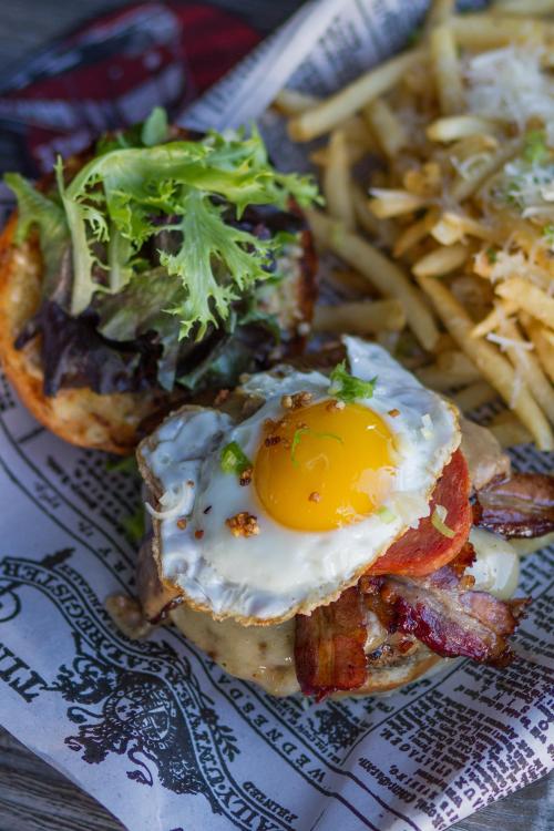 eggallthethings:  Spam, bacon, cheeseburger with an egg on top.