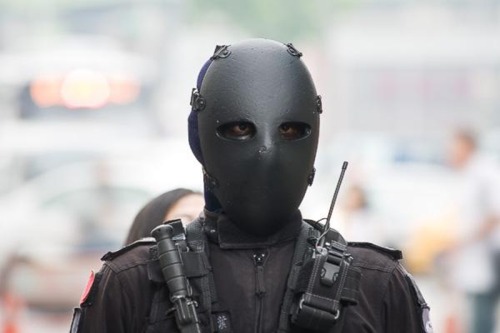 Black MaskTaiwanese soldiers with an interesting, if not intimidating piece of equipment. A ballistic face mask designed to protect the user from headshots. Meant for close range encounters, the masks are rated up to .44 Magnum but keep in mind that the