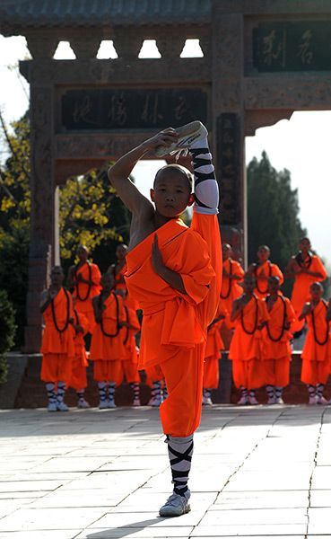 taichi-kungfu-show:  Young kid practicing Shaolin kung fu.    We offer you first-rate tai chi swords on: http://www.icnbuys.com/tai-chi-swords    