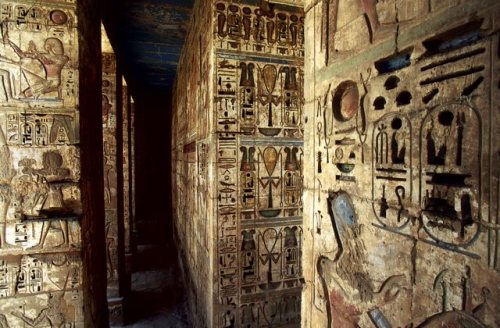 Detail of pillars and walls carved with figures and hieroglyphs. Medinet Habu, Mortuary temple of Ra