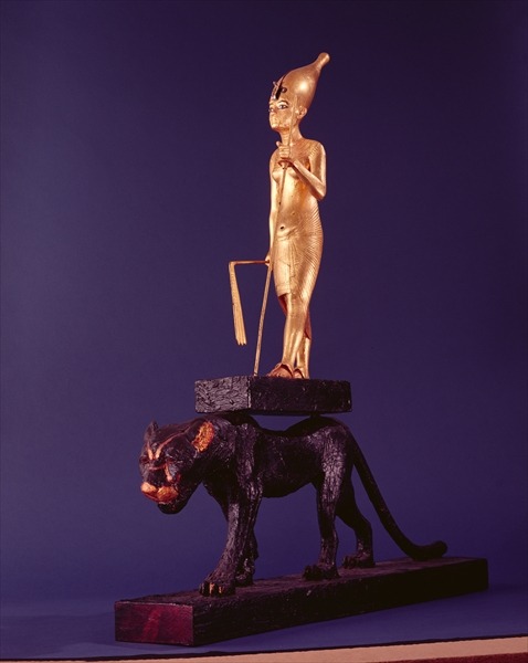 Statuette of Tutankhamun wearing the white crown, carried upon the back of a black leopard (wood and