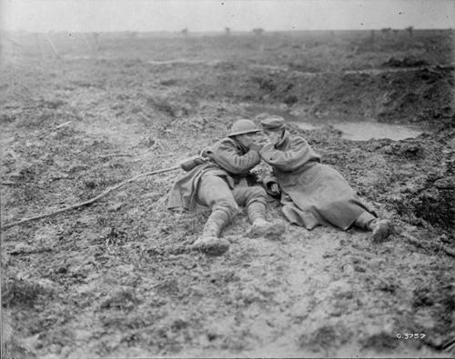 historicaltimes:Wounded Canadian and German soldier share a cigarette during Battle of Passchendaele