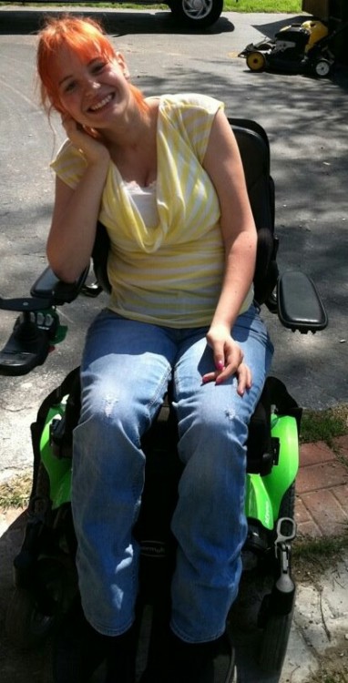 her electric wheelchair