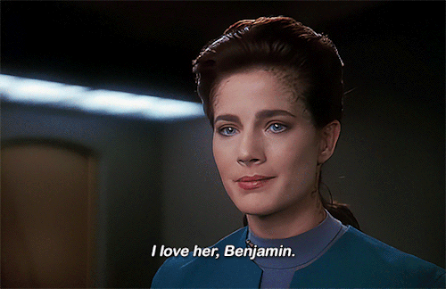 A gif from the Star Trek: DS9 episode “Rejoined”. Jadzia Dax, in a very emotional moment, confesses, “I love her, Benjamin”.