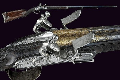 An ornate flintlock shotgun marked, “CANON TORDU, MANUFACTURE DE VERSAILLES”, 18th centu