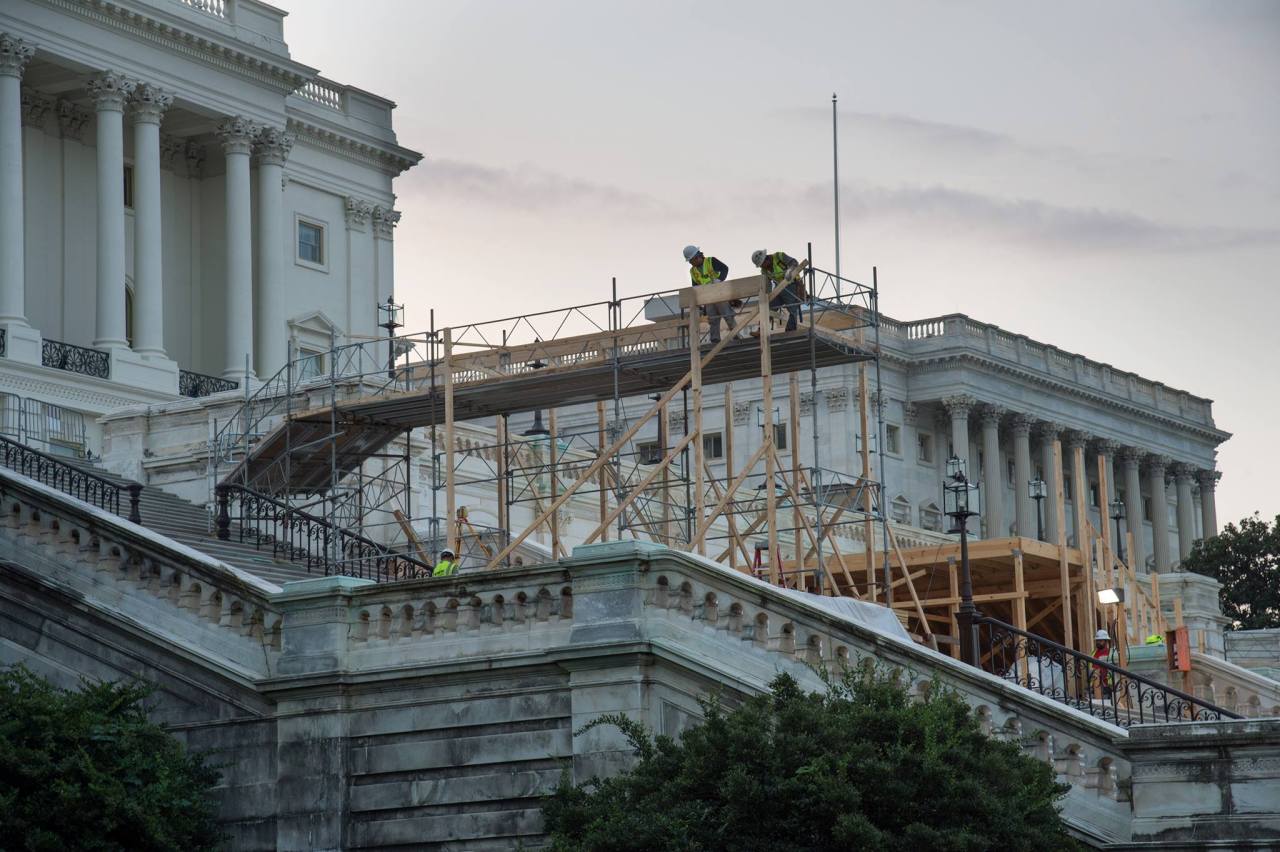 [ preceding photo: Construction on the inaugural platform at the United States Capitol, which began in November 2016. (image source: https://en.wikipedia.org/wiki/Inauguration_of_Donald_Trump#/media/File:Construction_on_the_inaugural_platform.jpg)...