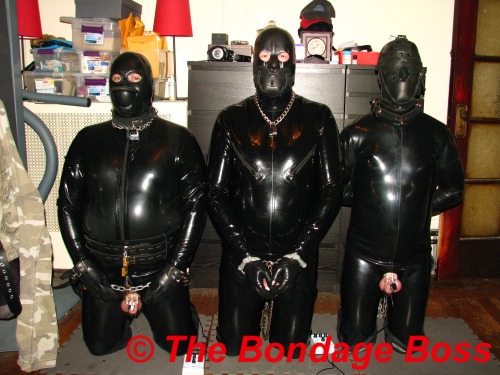 thebondageboss:  Three rubber slaves - property of The Bondage Boss. slave pup, Canadain pig and Seattle pig. 