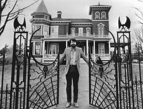 sixpenceee: Stephen King standing at the gate of his house in Bangor, Maine.