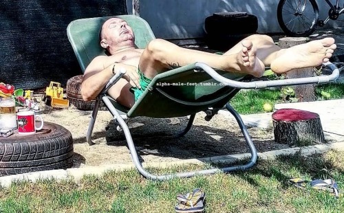 Cousin Jimbo relaxing by the garage after a hard day working on trucks.