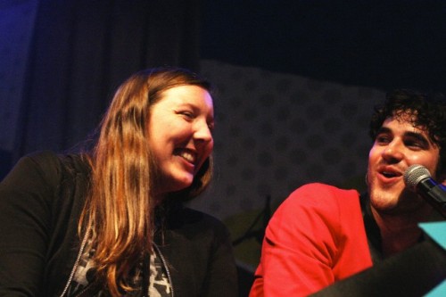 Darren Criss with a fan on stage in concert at The Fillmore in San Francisco, CA