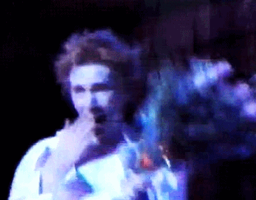 air-flows: Johnny Rotten receiving flowers as a pretty princess he is
