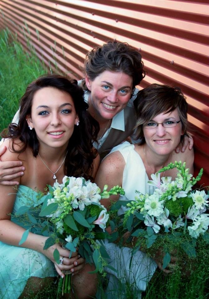 dripping-rhinestones:  My beautiful moms and I on their wedding day this summer.