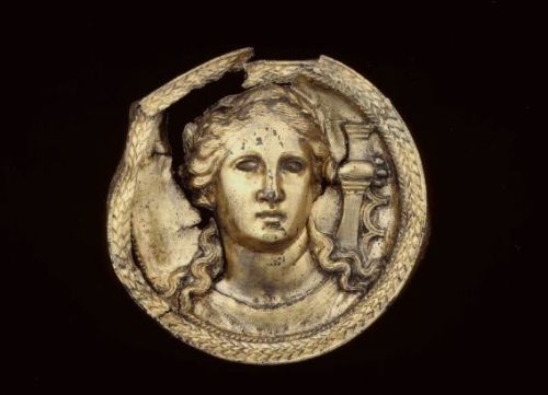 ancientpeoples:Gilded silver roundel with Apollo The god is shown as a musician, his lyre is shown o