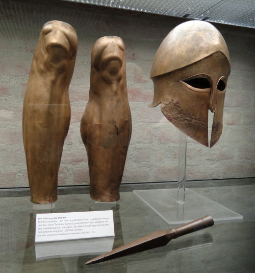 ancientart: Greave and Corinthian helmet from the tomb of Denda. The name of the warrior (Denda) is 