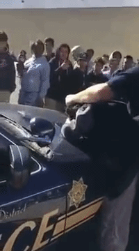 blackmattersus:    ​Children covered their burning eyes after this BULLY COP indiscriminately pepper sprayed a crowd of high school students.  Video