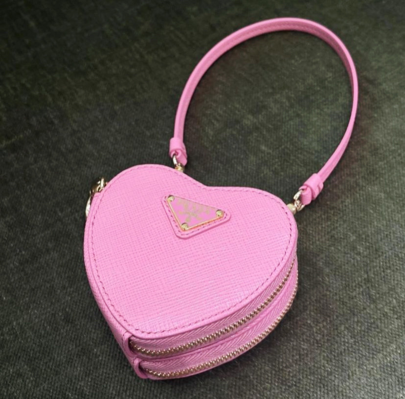 ♡Br3akfestattiffanys♡ — This little Prada heart shaped bag??
