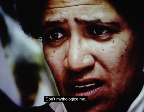 The image shows a close up of Audre Lorde's face as she speaks to her students. She concludes, "Don't mythologize me."