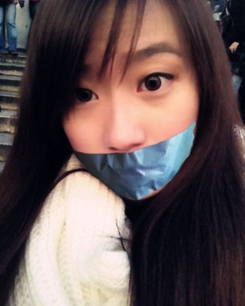 Asian girl fake tape gagged