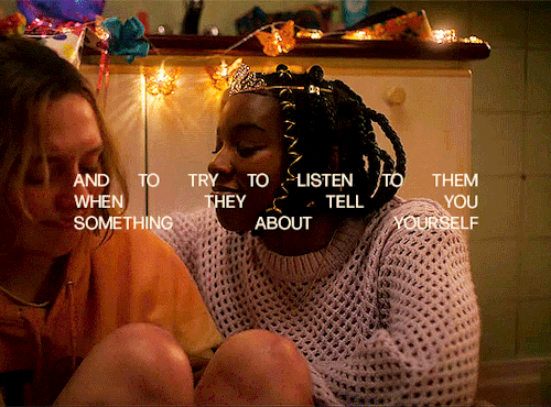 Tara and Darcy are sitting on the floor. Tara is pulling Darcy closer into a hug and Darcy lays down on her legs. The text in the gif says: "and to try to listen to them when they tell you something about yourself"