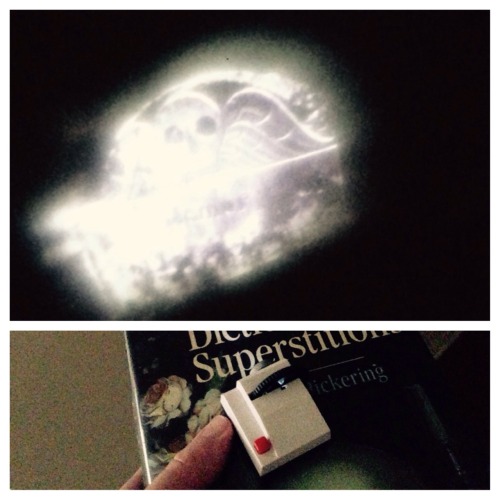 evilsupplyco:Atticus carries around a pocket projector with cemetery photos he took in Salem, MA on 