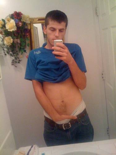 undie-fan-99:  Guy showing off in (what appears to be) his white Hanes boxerbriefs.
