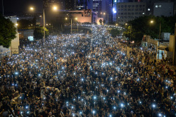citylights0:  trms:  Pro-democracy demonstrators hold up their mobile phones during a protest near the Hong Kong government headquarters on September 29, 2014. (Dale de la Rey/AFP/Getty Images)  Believe in Hong Kong