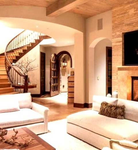 Enclosed - Contemporary Living Room
Image of a mid-sized, contemporary, enclosed living room with beige walls, a standard fireplace, a stone fireplace, and a wall-mounted television.