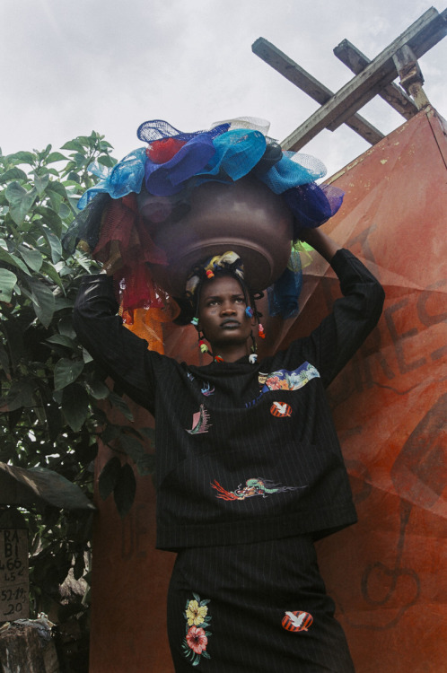 Dressed up in distressed, patched and unconventional clothing, shot on location in Abidjan, stylist 