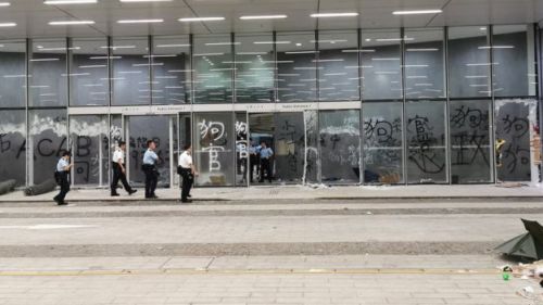 Anti-Police graffiti calling police ‘Dogs’ painted on the Legislative Council building in Hong Kong 