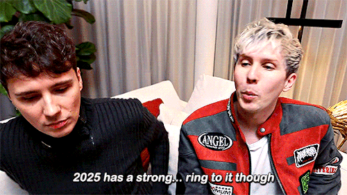 Phil says: "2025 has a strong... ring to it though" and mimes a circle with this hand
