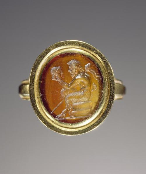 historyarchaeologyartefacts:Engraved gem (carnelian) set in a modern ring: Pan contemplating an acto