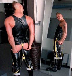 punkerskinhead:  a very sexy punk with mohawk and in rubber outfit 