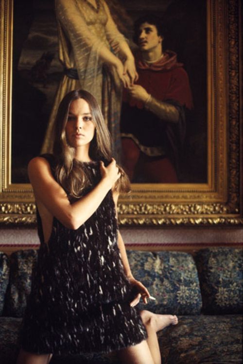 Michelle Phillips, posing with painting, was a founding member of The Mamas & the Papas. Photogr