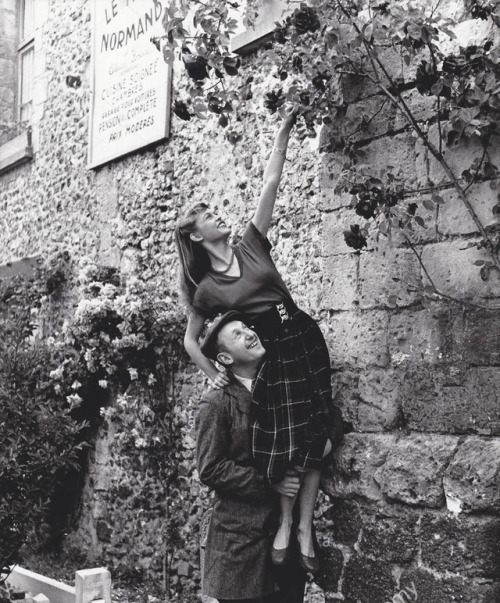 talesfromweirdland:French actor Bourvil lifts up Brigitte Bardot in a publicity shot for her very fi