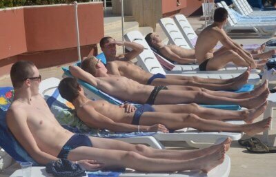 speedomatt:  Swim team getting some sun between practices over spring break Coach