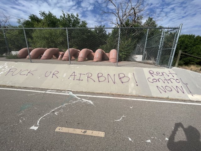 hater-of-terfs:radicalgraff:“Fuck ur AirBNB! Rent Control Now!”Seen in Lexington, VirginiaLove the graffiti but I was so certain that those pipes were the fingers of a giant clawing its way out of a ravine