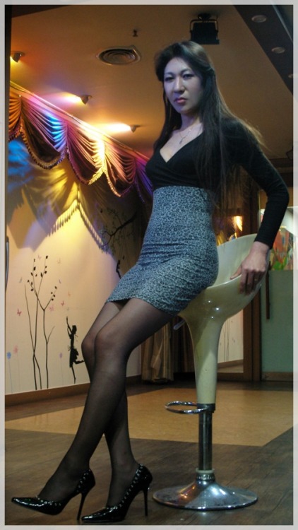 Asian transvestite in black pantyhose