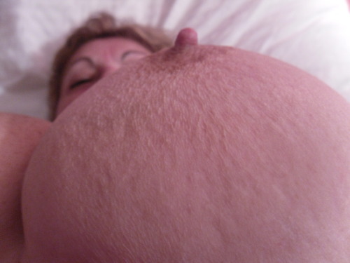 over60bigtits: My hard left nipple on top of my big natural tit.  Care to suck it? Yeahhhhh