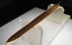 1000games: sixpenceee:    Sword of Goujian   This is a 2,500 year old sword discovered by archeologists in a tomb in Hubei, China.  .      I’m going to steal this sword, the power will consume me and throw the world into a 1000 year war against good