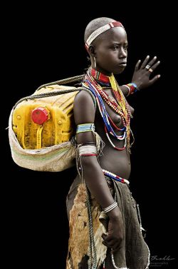 iseo58:Young Woman from the Arbore Tribe, Omo Valley by Pit Buehler