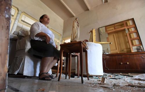 A woman in her damaged house in Beirut in the aftermath of the massive explosion from August 4, 2020