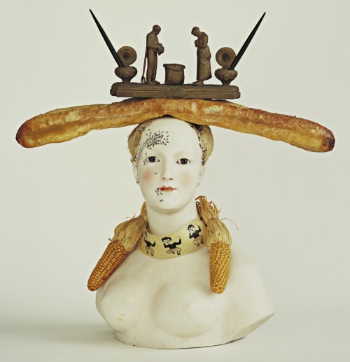Retrospective Bust of a WomanSalvador Dalí,1933Painted porcelain, bread, corn, feathers, pain