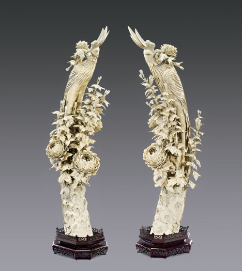 Pair of extremely tall and very elaborately carved, Chinese ivory phoenix birds: each standing among