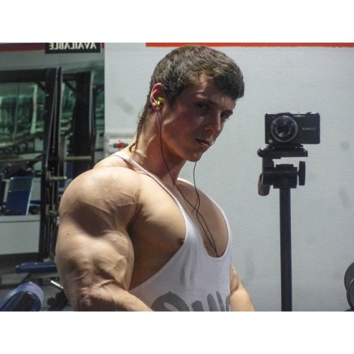 beautifulyoungmuscle:The stunning flexed biceps of Zach Zeiler. Piled high with muscle, studded with veins, rippling with mass and power, they’re erotic totems of beautiful young muscle.
