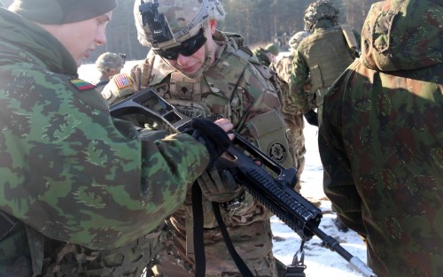 militaryarmament:  Lightning Troop, 3rd Squadron, 2nd Cavalry Regiment get to know the Soldiers and equipment of the Algirdas Battalion, Iron Wolf Brigade, Lithuanian land forces at Rukla, Lithuania, Feb. 2, 2015.
