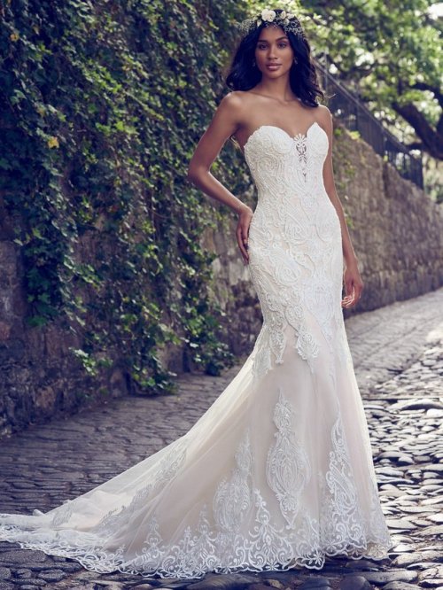 bellethemagazine: Maggie Sottero - AUTUMN, Beaded lace motifs cascade over tulle in this fit-and-fla