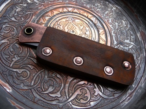 ru-titley-knives: Rustic style pocket slip for a pimped copper Opimod .  Custom knives , sheaths and