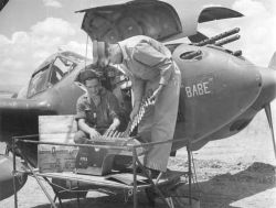 warhistoryonline:USAAF armorers examining the 20mm cannon ammunition of P-38 Lightning aircraft “Babe”. http://wrhstol.com/2tn7fp0