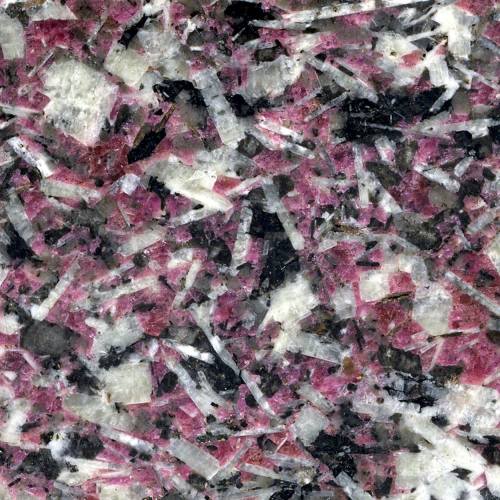 Eudialyte syenite Isn’t that a delightful color? The mineral with the strong color is Eudialyt